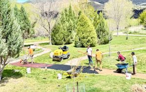 Workers applied the earth colored aggregate.
