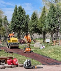 Amazing energetic, purposeful Iron Horse workers finalizing the pathway